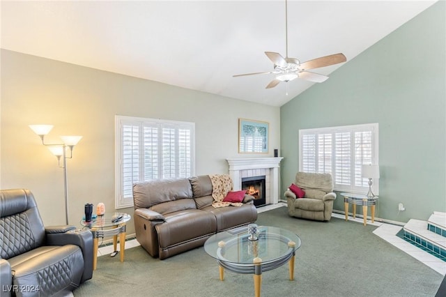 living room with plenty of natural light, carpet flooring, lofted ceiling, and a fireplace