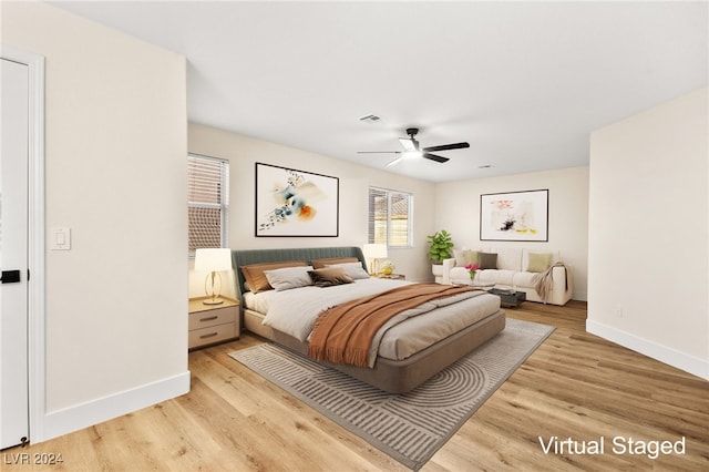 bedroom featuring ceiling fan and light hardwood / wood-style floors