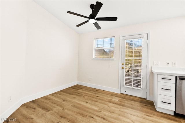 spare room featuring ceiling fan, lofted ceiling, and light hardwood / wood-style flooring