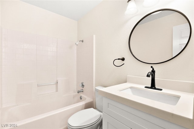 full bathroom featuring bathing tub / shower combination, vanity, and toilet