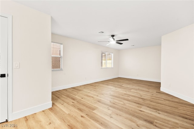 spare room with ceiling fan and light hardwood / wood-style flooring