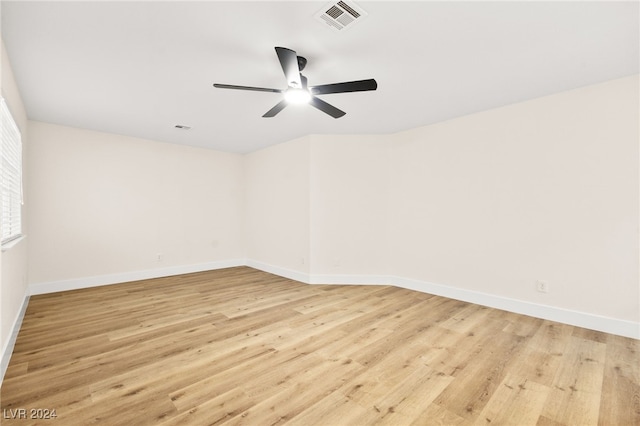 spare room featuring ceiling fan and light wood-type flooring