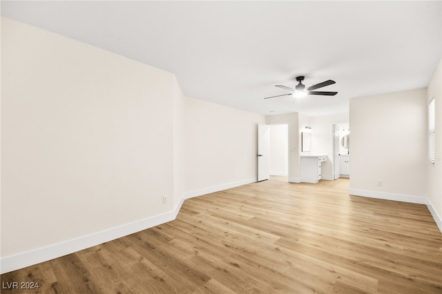 unfurnished room with ceiling fan and light wood-type flooring