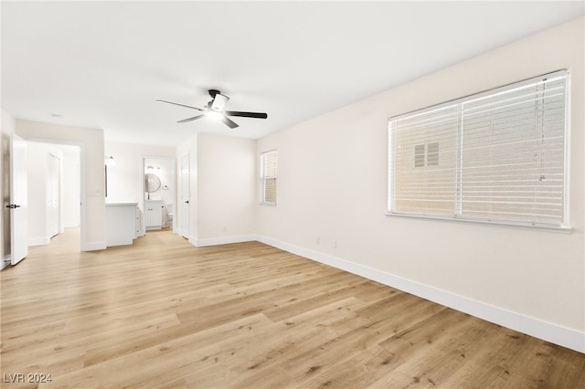 unfurnished living room with ceiling fan and light wood-type flooring