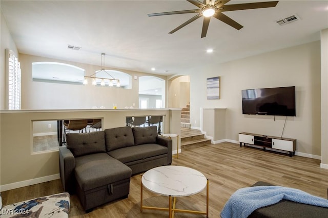 living room featuring hardwood / wood-style flooring and ceiling fan