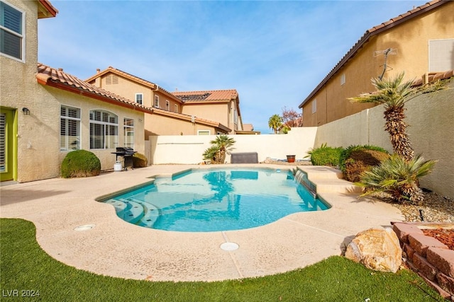 view of pool featuring central air condition unit, a grill, and a patio