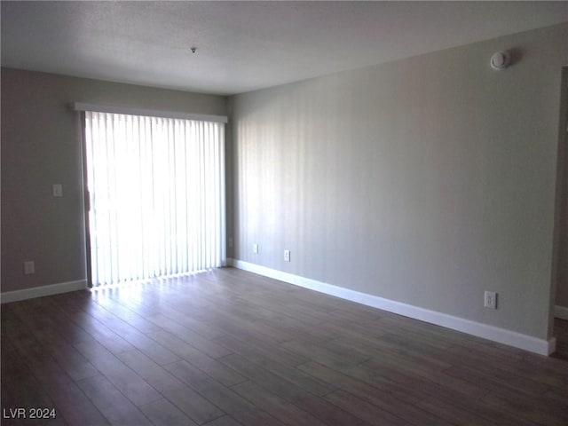 empty room featuring dark hardwood / wood-style floors