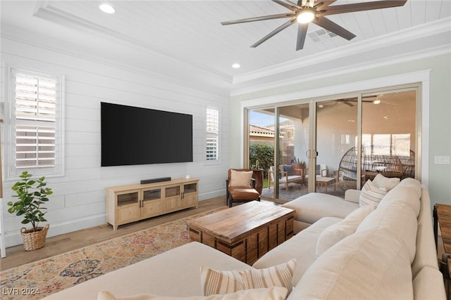 living room with ornamental molding and hardwood / wood-style flooring