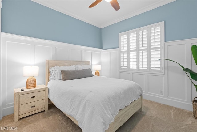 bedroom with carpet flooring, ceiling fan, and ornamental molding