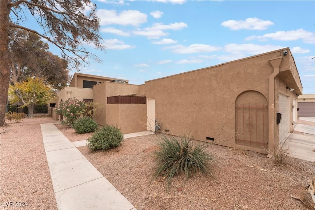 view of property exterior with a garage