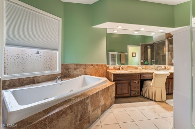 bathroom featuring tile patterned floors, vanity, and plus walk in shower