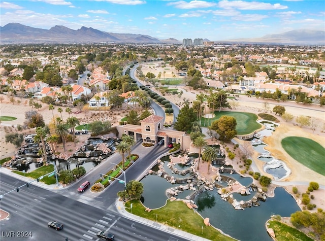 birds eye view of property with a water and mountain view