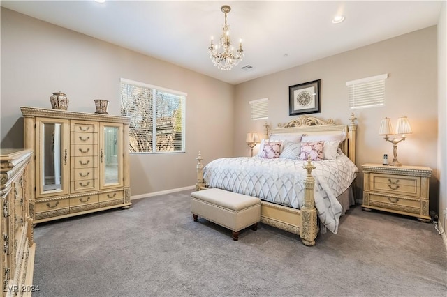 carpeted bedroom featuring an inviting chandelier