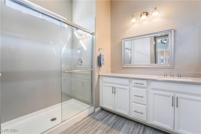 bathroom with vanity and an enclosed shower