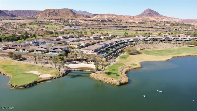 drone / aerial view with a water and mountain view