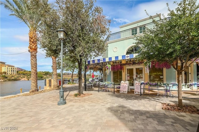 surrounding community featuring a water view