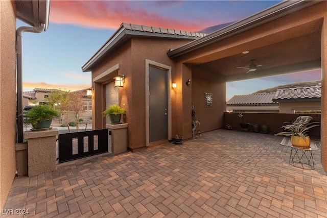 patio terrace at dusk with ceiling fan