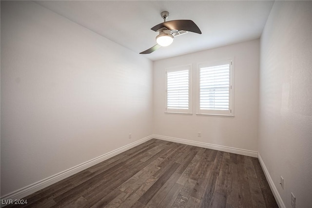 empty room with ceiling fan and dark wood-type flooring