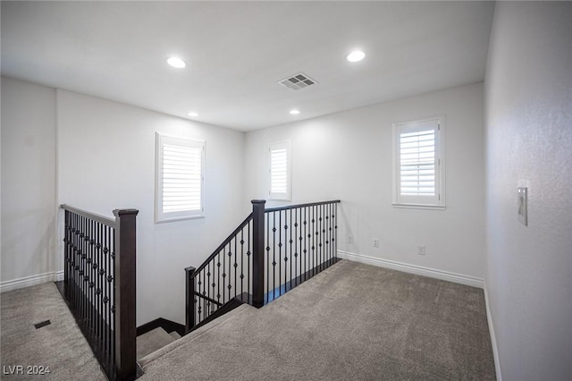 staircase with carpet