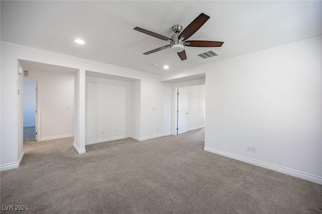 interior space with ceiling fan and light carpet