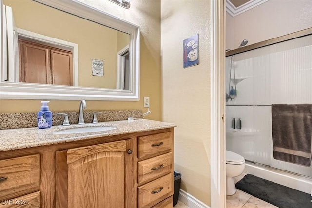 bathroom with toilet, an enclosed shower, crown molding, and vanity