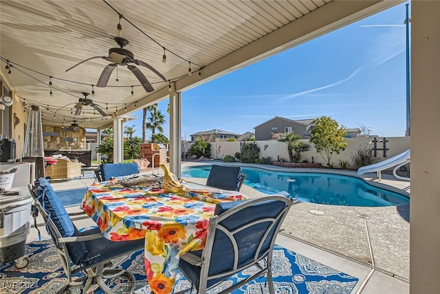 view of pool featuring a patio and a water slide