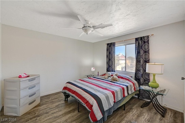 bedroom featuring a textured ceiling, ceiling fan, and hardwood / wood-style flooring