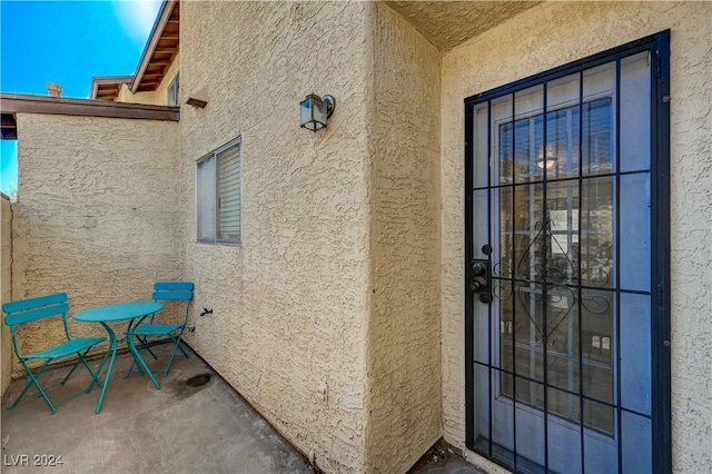 doorway to property featuring a patio