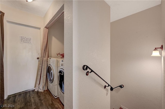 washroom with dark hardwood / wood-style floors and independent washer and dryer