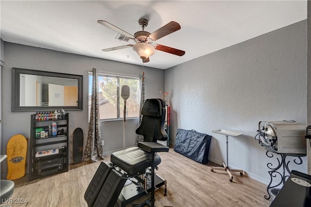 interior space with ceiling fan and light wood-type flooring