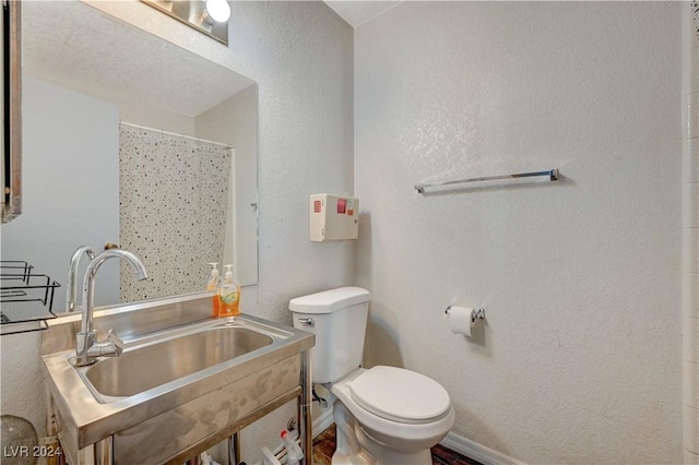 bathroom with toilet and sink