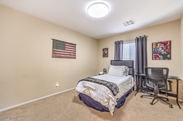 bedroom featuring light carpet