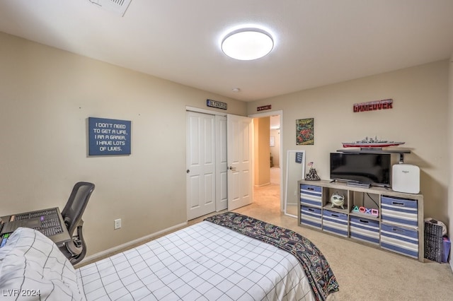 bedroom featuring carpet and a closet