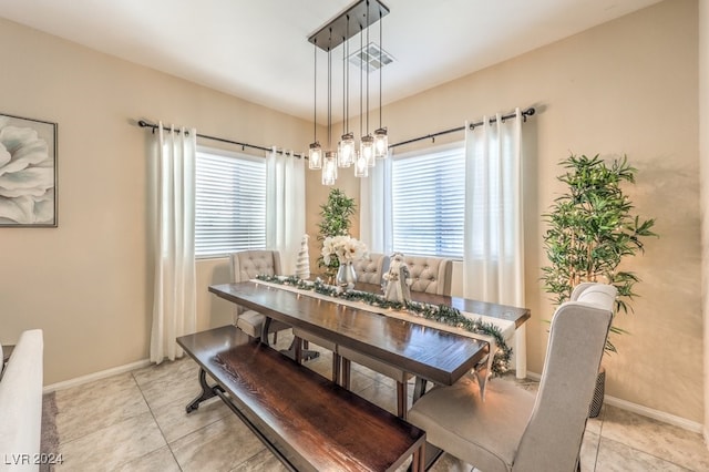 dining area featuring a healthy amount of sunlight and light tile patterned floors