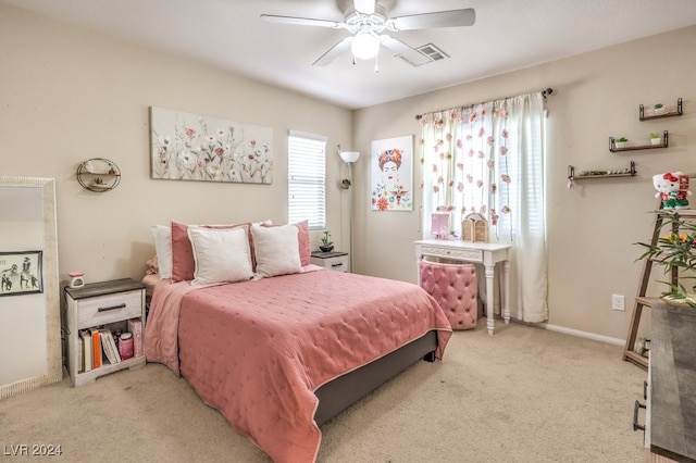 bedroom with light carpet and ceiling fan