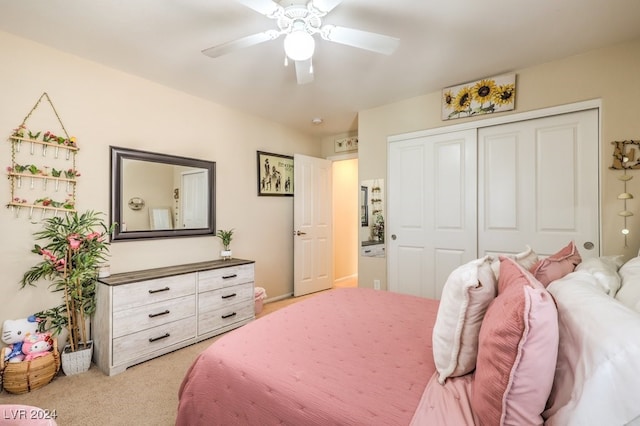 carpeted bedroom featuring a closet and ceiling fan