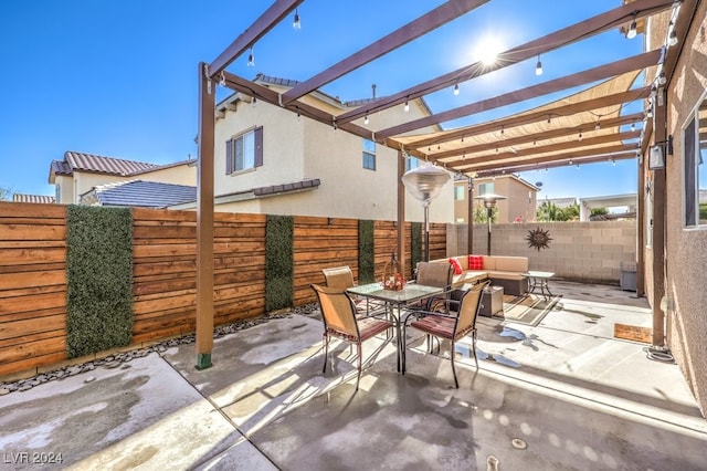 view of patio / terrace with a pergola and an outdoor living space