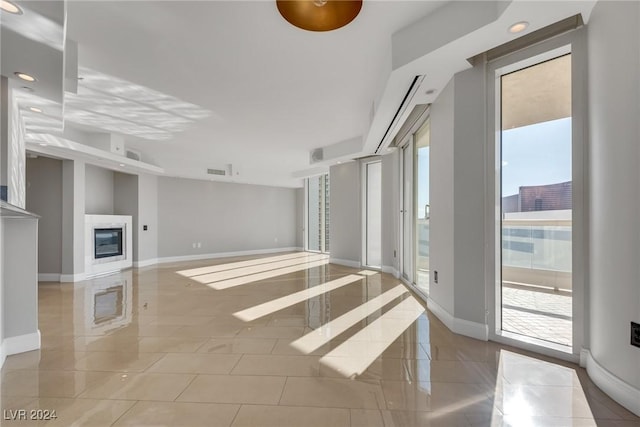 unfurnished living room featuring light tile patterned floors