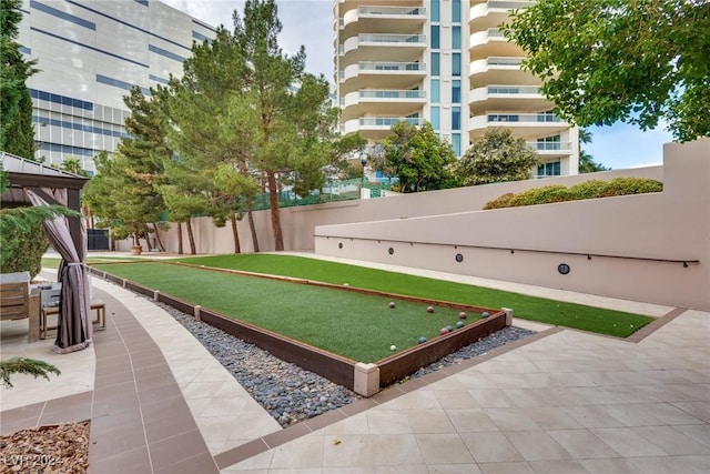 view of property's community featuring fence