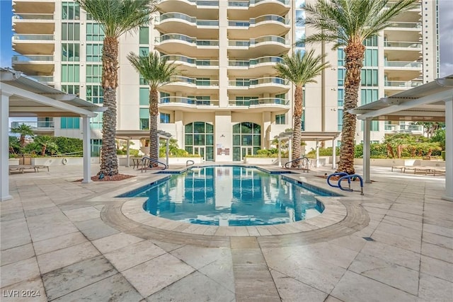 view of swimming pool featuring a patio area