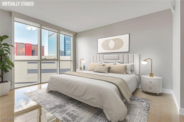 bedroom with light tile patterned flooring and floor to ceiling windows