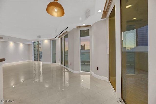 spare room featuring light tile patterned floors