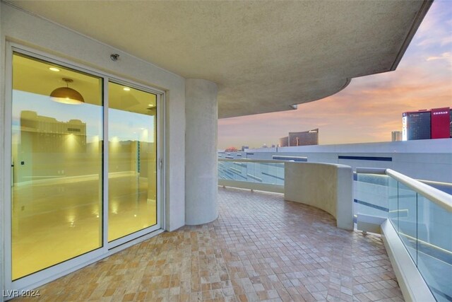 view of balcony at dusk