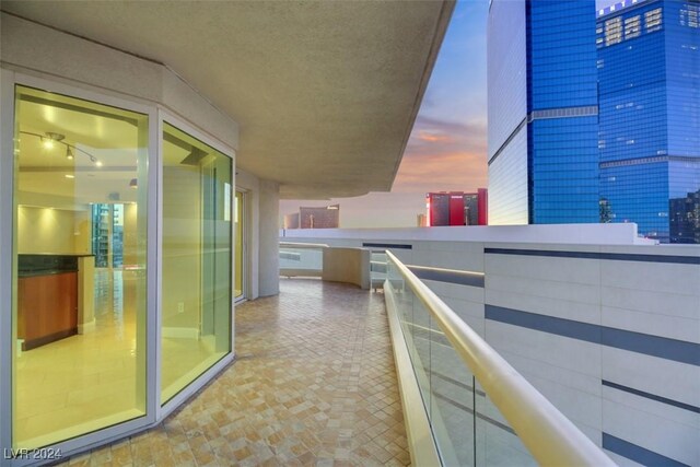 view of balcony at dusk