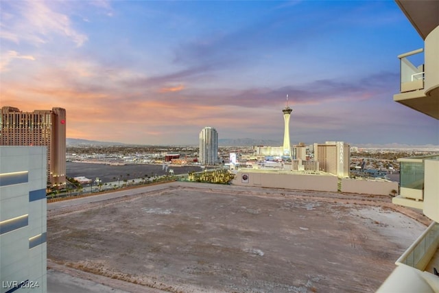 patio terrace at dusk with a city view