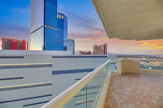 view of balcony at dusk