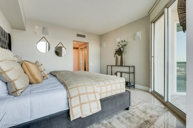 tiled bedroom featuring access to outside, visible vents, and baseboards