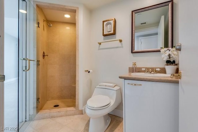 full bath with a stall shower, vanity, and toilet