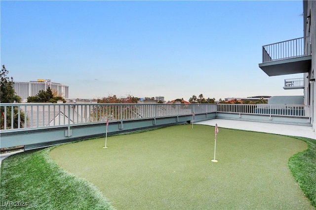 view of yard with a balcony