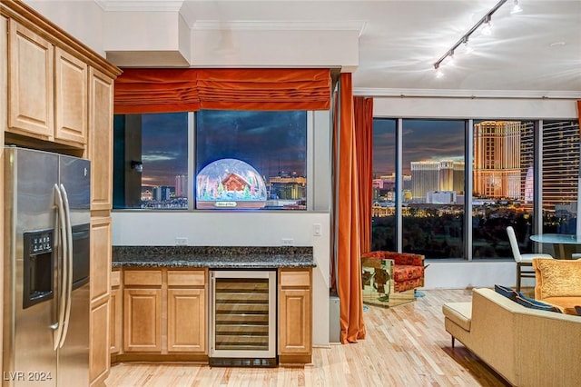 kitchen featuring stainless steel refrigerator with ice dispenser, light wood-type flooring, track lighting, crown molding, and wine cooler